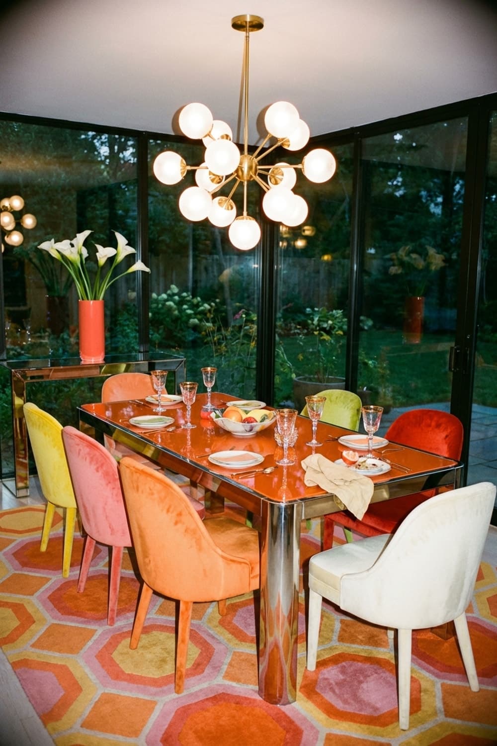 Glimmers Between Garden and Gathering - dining room, orange, yellow, red, modern chandelier - Room Inspiration