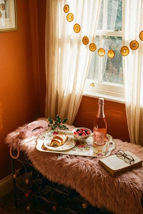Sunrise and Sparkling Anticipation - breakfast nook, orange walls, pink telephone