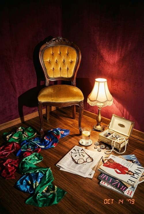 Shadows and Silk After the Show - corner room, burgundy walls, gold chair